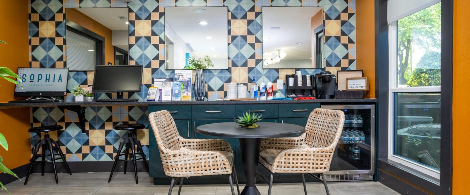 a colorful kitchen with a table and chairs at The  Sophia