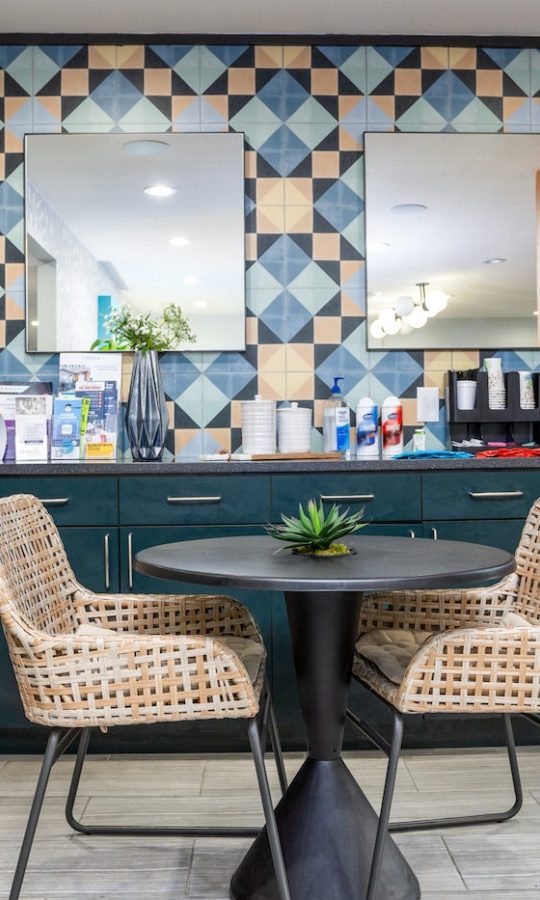 a colorful kitchen with a table and chairs at The  Sophia