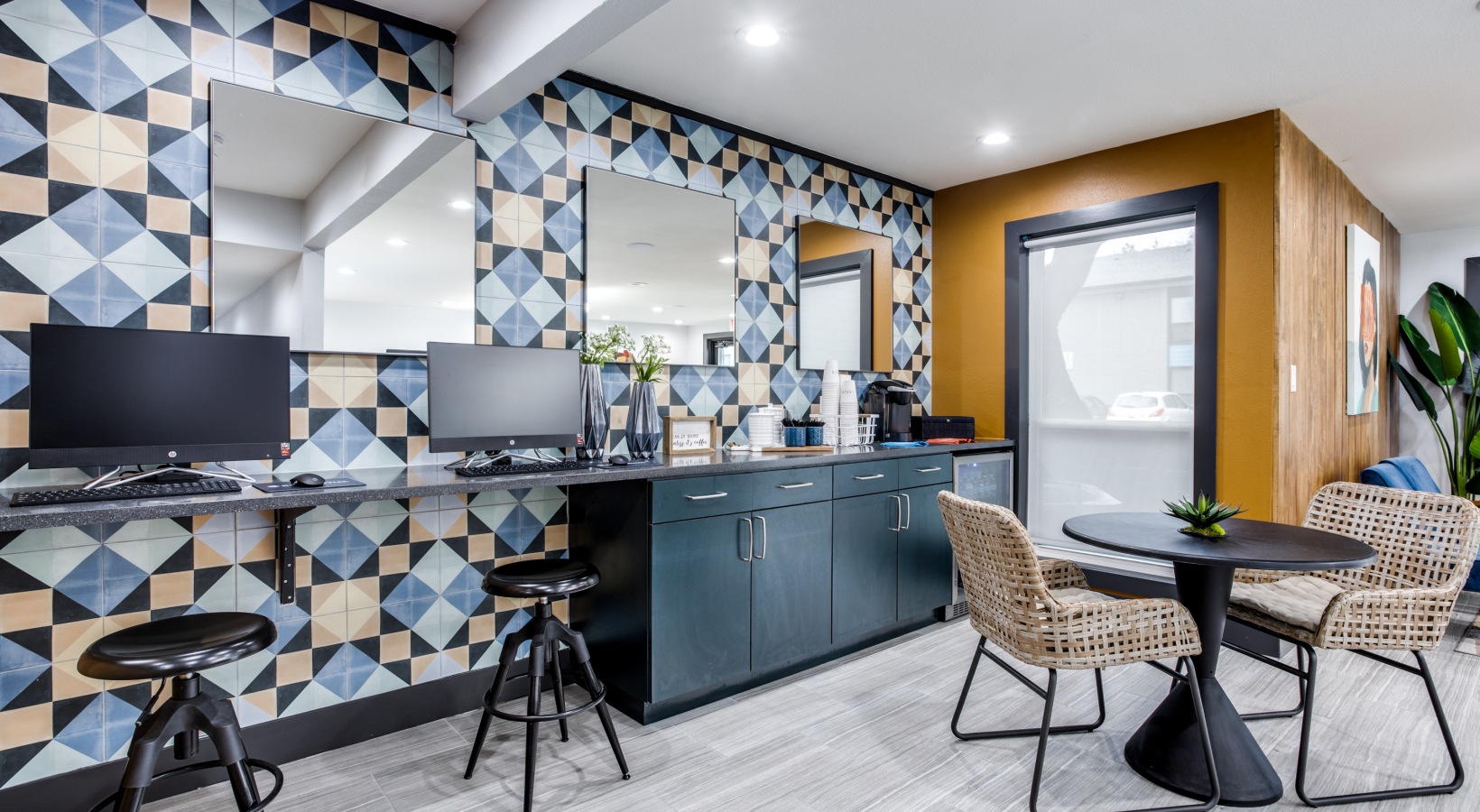 a kitchen with a blue and yellow tile pattern at The  Sophia