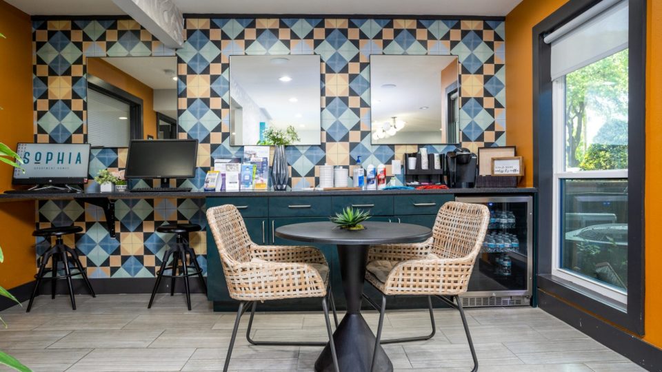 a colorful kitchen with a table and chairs at The  Sophia